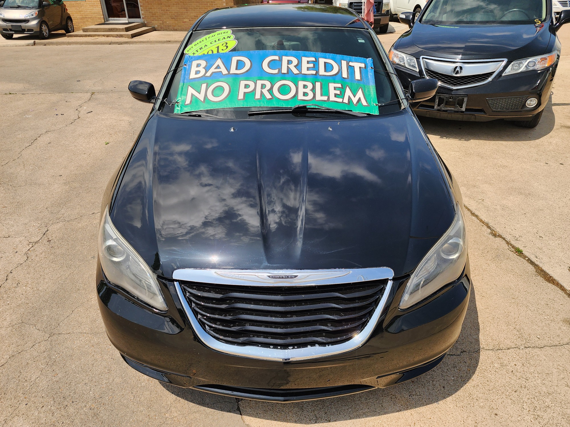 2013 BLACK Chrysler 200 Touring (1C3CCBBB2DN) with an 2.4L L4 DOHC 16V engine, 6-Speed Automatic transmission, located at 2660 S.Garland Avenue, Garland, TX, 75041, (469) 298-3118, 32.885551, -96.655602 - Welcome to DallasAutos4Less, one of the Premier BUY HERE PAY HERE Dealers in the North Dallas Area. We specialize in financing to people with NO CREDIT or BAD CREDIT. We need proof of income, proof of residence, and a ID. Come buy your new car from us today!! This is a very well cared for 2013 Ch - Photo #8